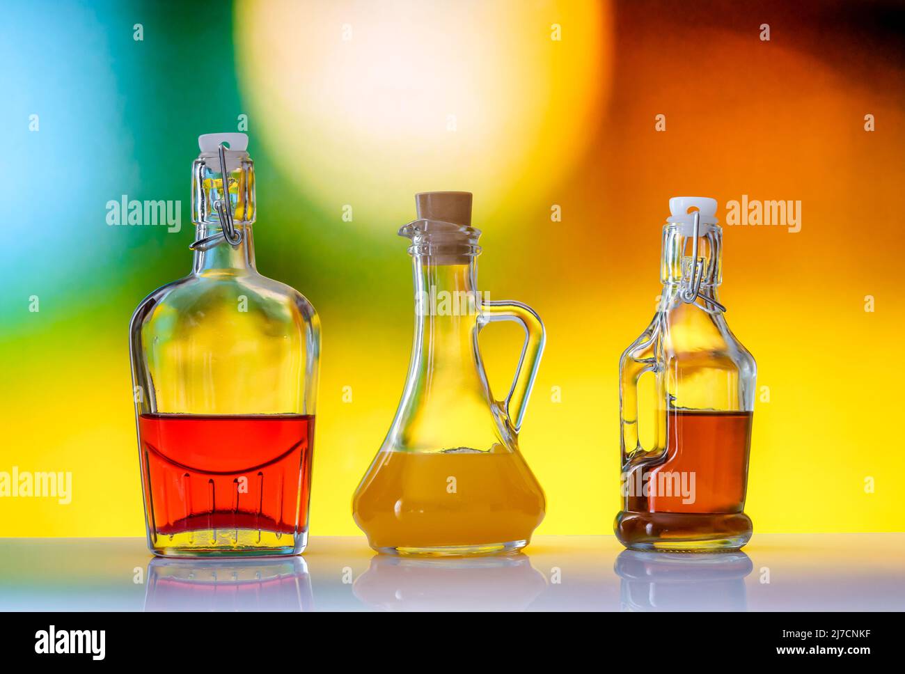 stylish bottles with colored alcohol, drinks on a soft blurred background Stock Photo
