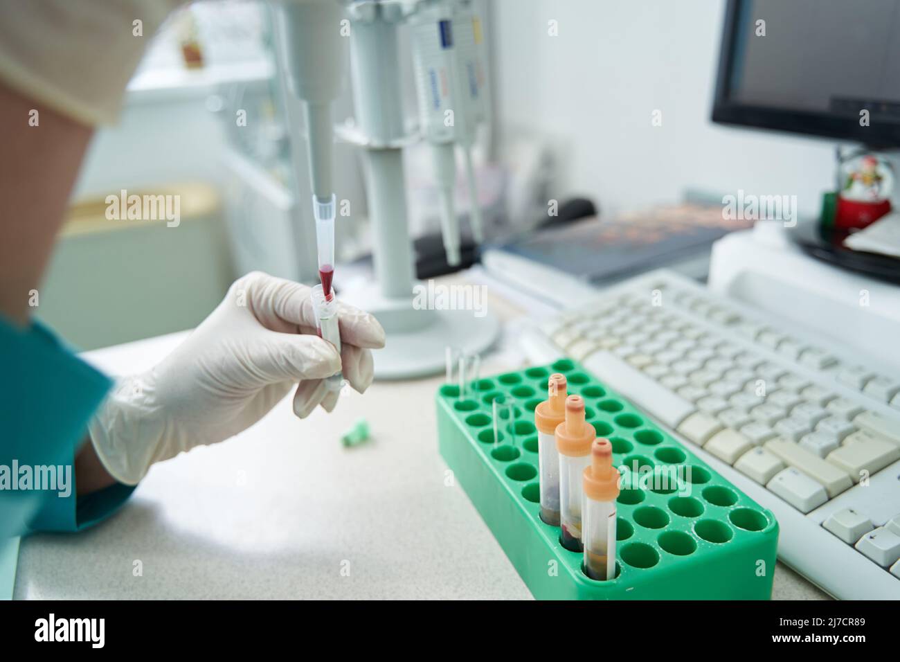 Woman examining chemistry blood tests before computer Stock Photo Alamy