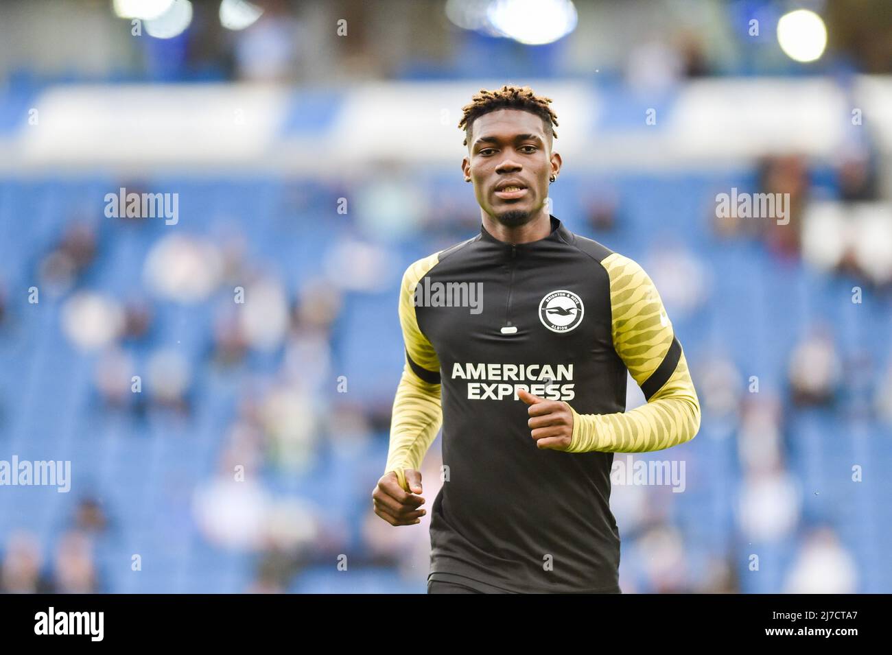 Yves Bissouma of Brighton warming up during the Premier League match between Brighton and Hove Albion and Manchester United at the American Express Stadium  , Brighton , UK - 7th May 2022  Editorial use only. No merchandising. For Football images FA and Premier League restrictions apply inc. no internet/mobile usage without FAPL license - for details contact Football Dataco Stock Photo