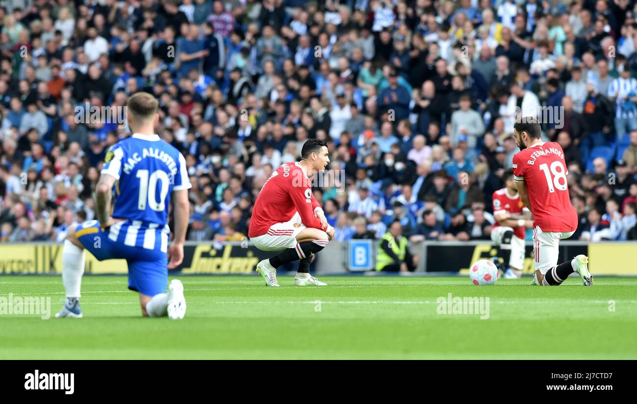 Cristiano Ronaldo of Manchester United takes the knee during  the Premier League match between Brighton and Hove Albion and Manchester United at the American Express Stadium  , Brighton , UK - 7th May 2022  Editorial use only. No merchandising. For Football images FA and Premier League restrictions apply inc. no internet/mobile usage without FAPL license - for details contact Football Dataco Stock Photo