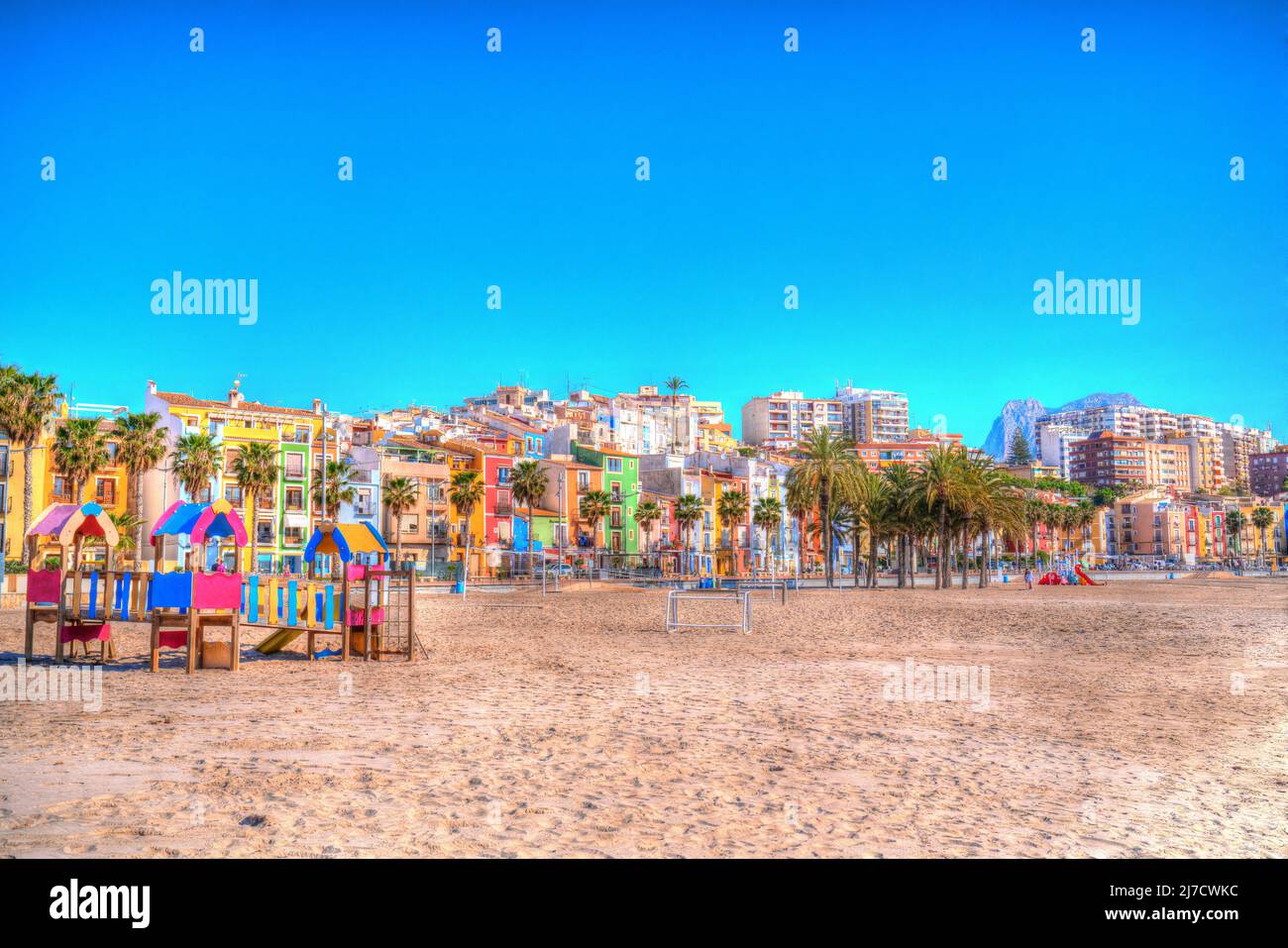 Villajoyosa Spain colourful beach scene with play area Costa Blanca Alicante hdr Stock Photo