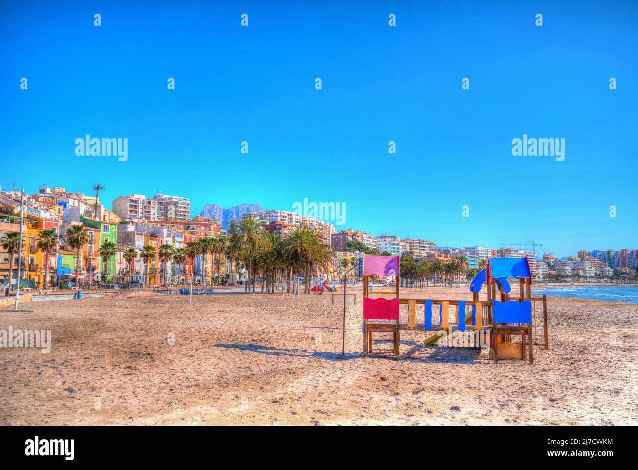 Villajoyosa Spain colourful beach scene with play area Costa Blanca Alicante hdr Stock Photo