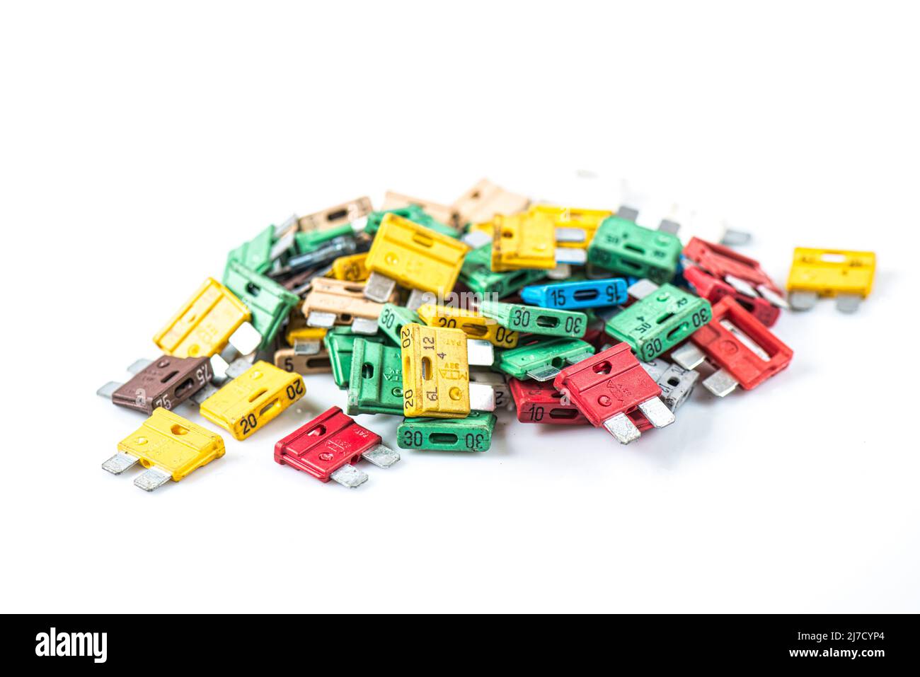 Various Powers and Colours of Car Fuses on White Background Stock Photo