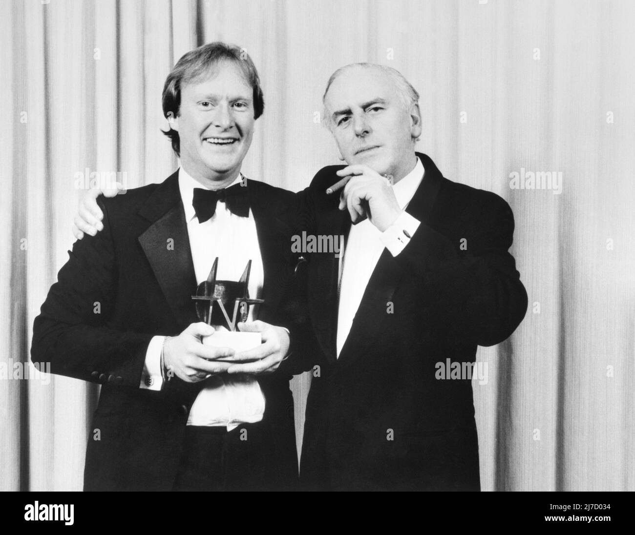 File photo dated 19/02/85 of Minder stars, Dennis Waterman (left) and George Cole with the Editor's Special Award for the programme at the TV Times magazine's awards ceremony. Dennis Waterman, who starred in TV shows including The Sweeney, Minder and New Tricks, has died at the age of 74. Issue date: Sunday May 8, 2022. Stock Photo