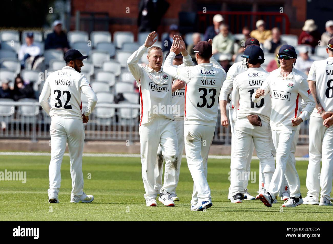 8th May 2022,  Emirates Old Trafford, Manchester, England: LV = County Cricket championship, Lancashire versus Warwickshire: Matt Parkinson of Lancashire celebrates with his team mates after taking the sixth Warwickshire wicket to leave the visitors on 138-6 just before tea with the home team having a scent of an unexpected win Stock Photo