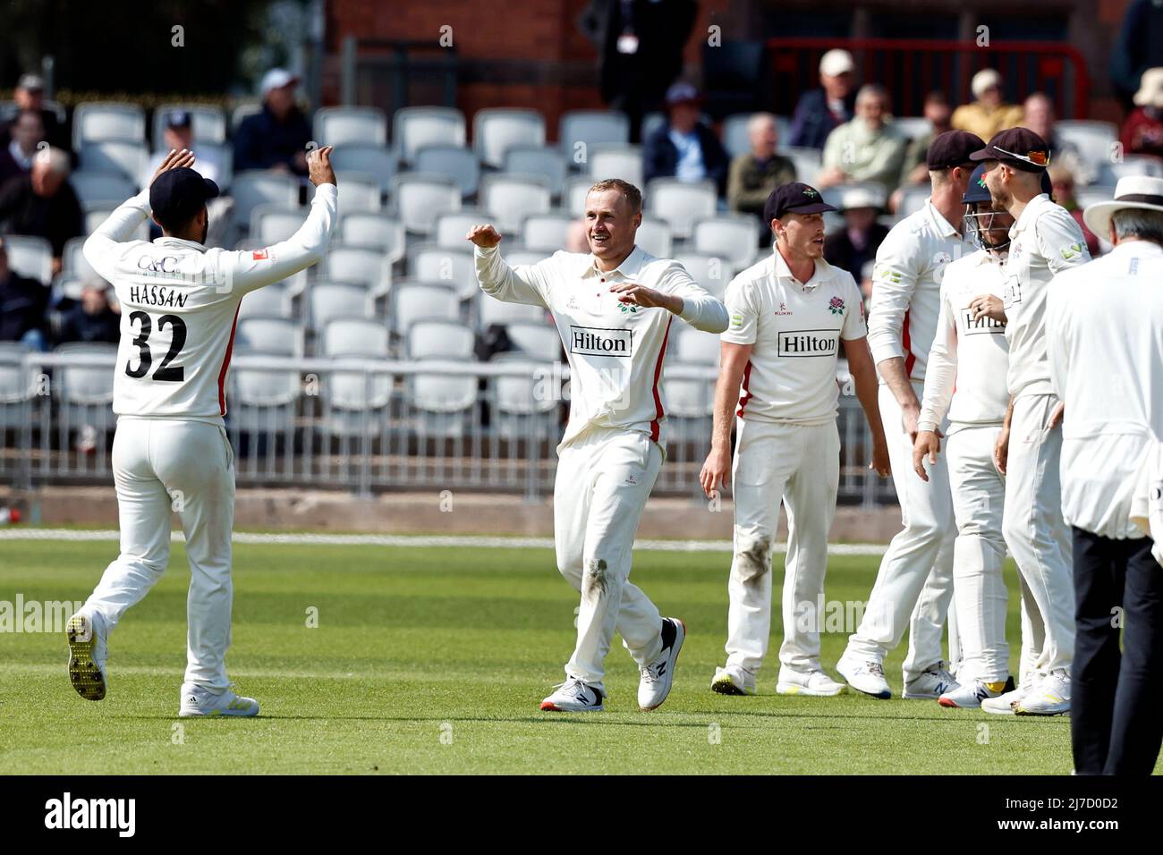 8th May 2022,  Emirates Old Trafford, Manchester, England: LV = County Cricket championship, Lancashire versus Warwickshire: Matt Parkinson of Lancashire celebrates with his team mates after taking the sixth Warwickshire wicket to leave the visitors on 138-6 just before tea with the home team having a scent of an unexpected win Stock Photo