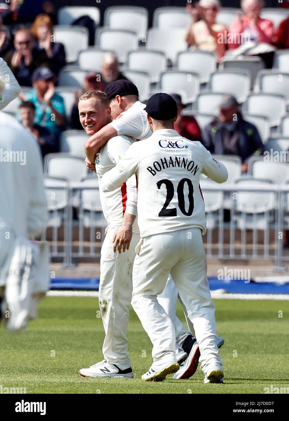 8th May 2022,  Emirates Old Trafford, Manchester, England: LV = County Cricket championship, Lancashire versus Warwickshire: Matt Parkinson of Lancashire celebrates with his team mates after taking the sixth Warwickshire wicket to leave the visitors on 138-6 just before tea with the home team having a scent of an unexpected win Stock Photo