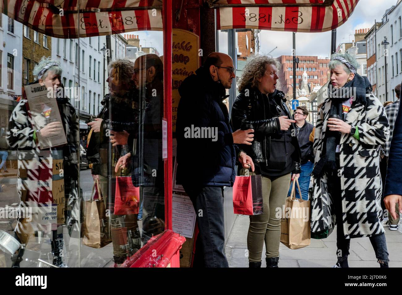 Customers outside the Algerian Coffee Stores premises, Old Compton Street, Soho, London, UK. Stock Photo