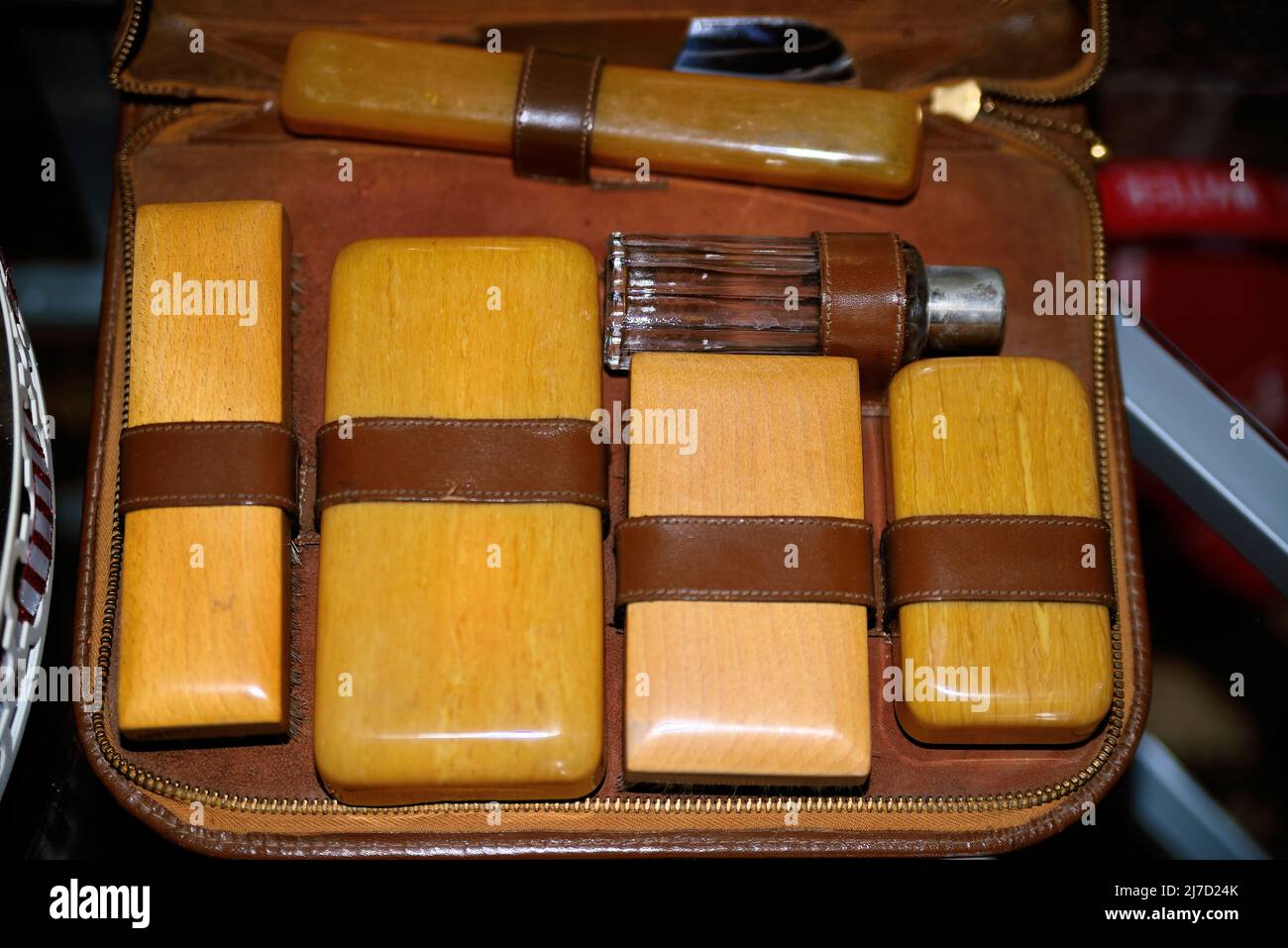 A gentleman's travel kit. The groming items have wooden backs, and all are set in a leather travel case. Stock Photo