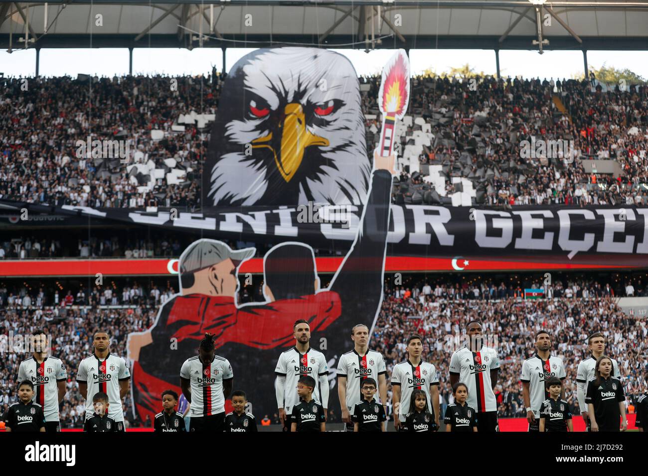 Soccer Football - Super Lig - Besiktas v Fenerbahce - Vodafone Park,  Istanbul, Turkey - May 8, 2022 Besiktas players line up as fans hold up  banners to form a tifo inside