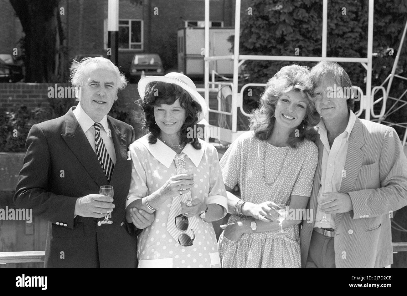 File photo dated 21/07/85 of Minder stars, George Cole (left) with his wife Penny (second left) and Dennis Waterman with girlfriend Rula Lenska at Twickenham Film Studios, London. Dennis Waterman, who starred in TV shows including The Sweeney, Minder and New Tricks, has died at the age of 74. Issue date: Sunday May 8, 2022. Stock Photo