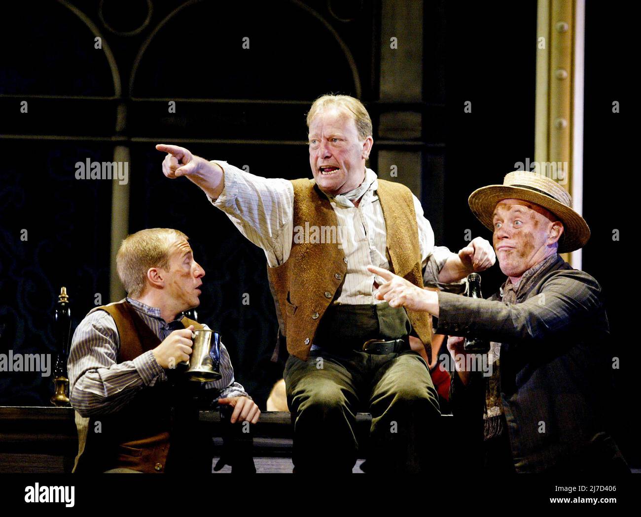 centre: Dennis Waterman (Alfred P Doolittle) in MY FAIR LADY at the Theatre Royal, Drury Lane, London WC2  20/05/2002 a National Theatre & Cameron Mackintosh co-production  book & lyrics: Alan Jay Lerner  music: Frederick Loewe  after 'Pygmalion' by George Bernard Shaw  design: Anthony Ward  lighting: David Hersey  musical staging & choreography: Matthew Bourne  director: Trevor Nunn Stock Photo