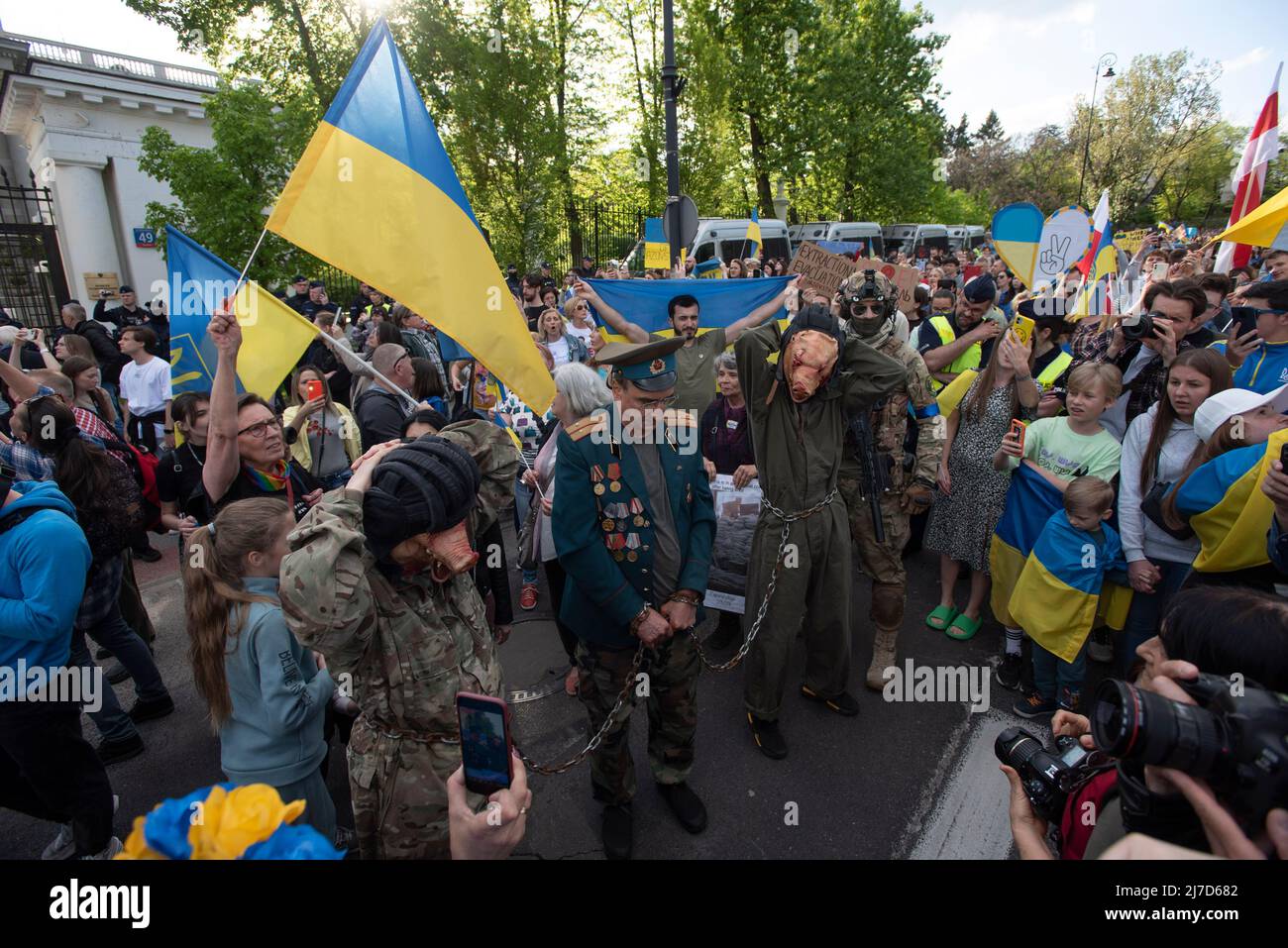 May 8, 2022, Warsaw, Warsaw, Poland: Protesters dressed as Russian servicemens and one as a general are surrounded by Demonstrators from Ukraine on May 8, 2022 in Warsaw, Poland. Around a few thousands of Ukrainians living in Poland and their supporters marched through the centre of Warsaw, on the day that marks the 72nd day of Russian invasion of Ukraine, to protest against the war and underline that Russian since day one of the invasion has not achieved any victory. On the same day people in Ukraine celebrate Ukraineâ€™s Day of Remembrance and Reconciliation. (Credit Image: © Aleksander Kalk Stock Photo