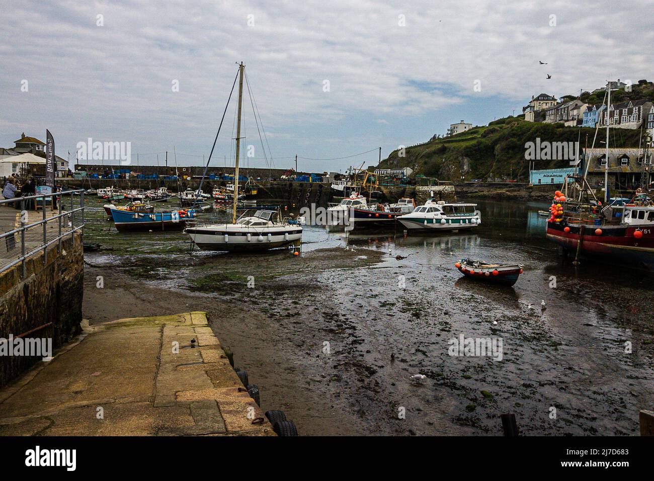 Boats anchored when the tide is out at West Looe; Cornwall; UK Stock Photo