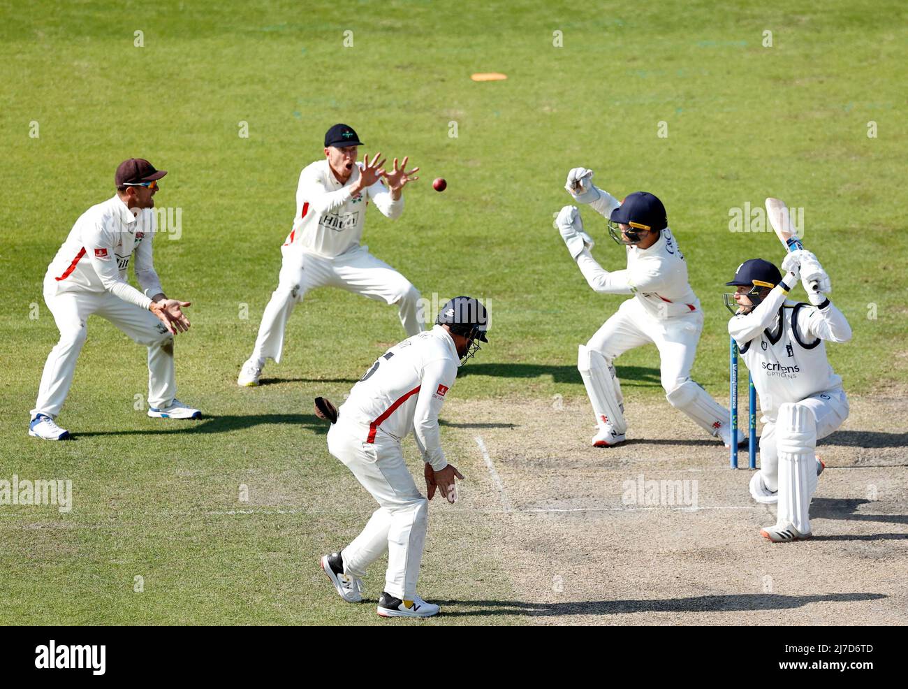 8th May 2022,  Emirates Old Trafford, Manchester, England: LV = County Cricket championship, Lancashire versus Warwickshire: Chris Benjamin of Warwickshire looks on as a ball from spinner Matt Parkinson flies up off his pads towards the hands of Luke Wells of Lancashire, with the match heading towards a draw Stock Photo