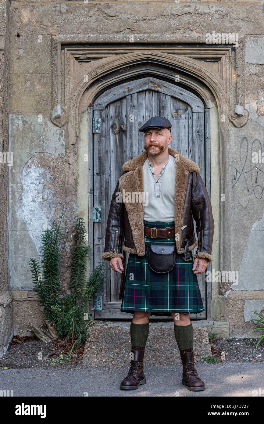 Male dressed in kilt with casual outfit Stock Photo