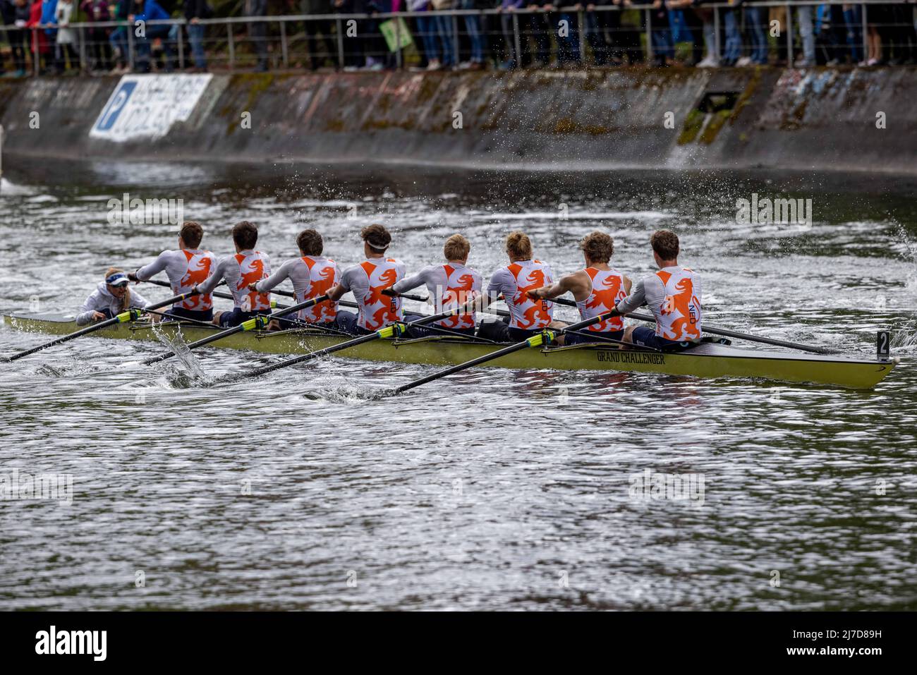 The two men's crews enter the Montlake Cut, followed by race monitoring ...