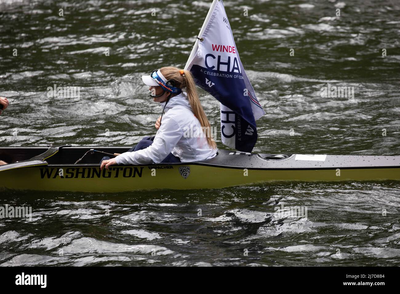 The winning men's crew slowly paddles back to the starting point after ...