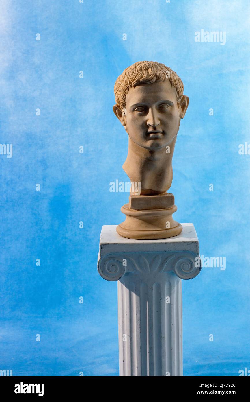 Bust presented on a pedestal with sky background in studio Stock Photo