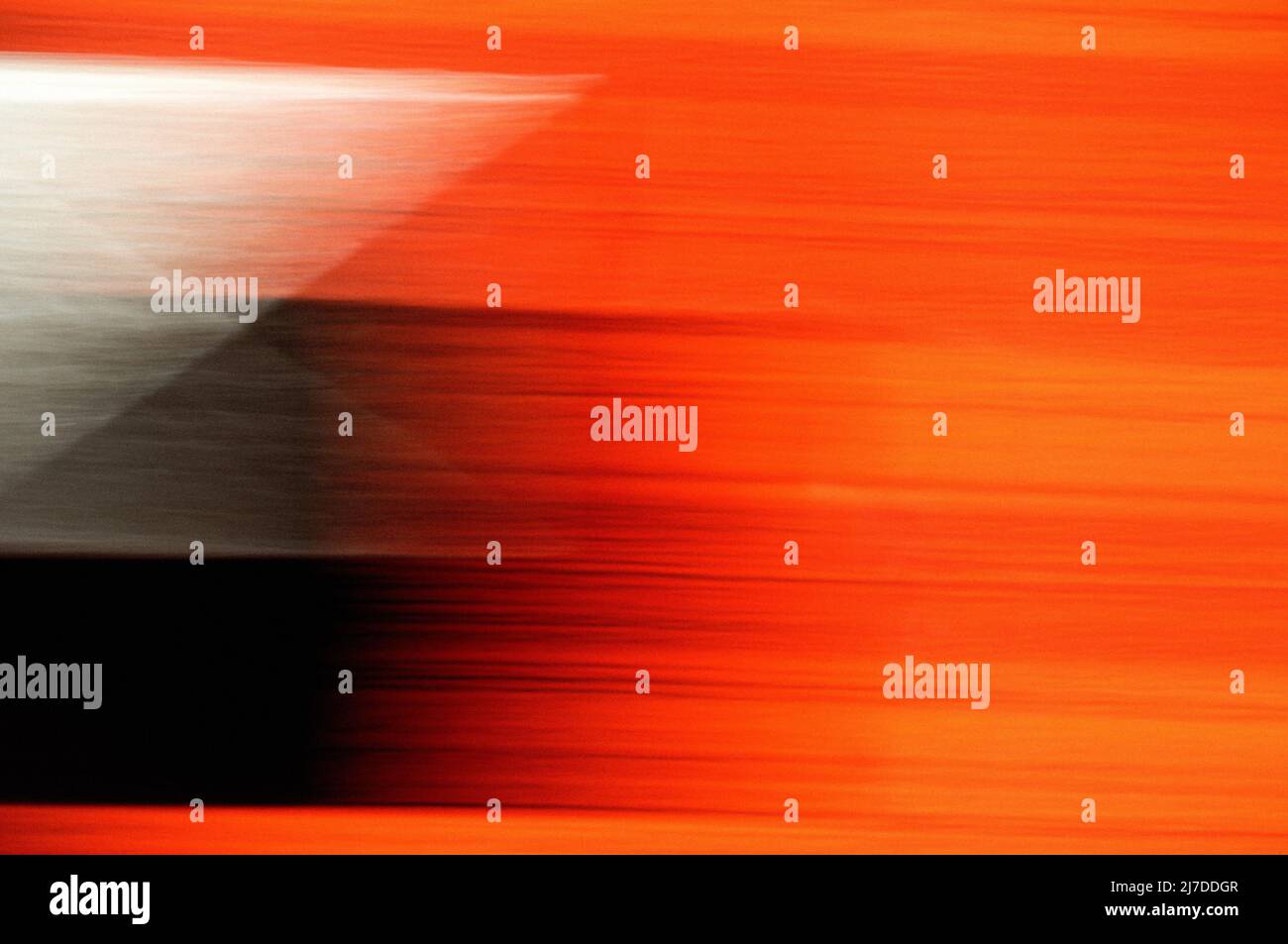 Blurred motion design of orange, black and white. Stock Photo