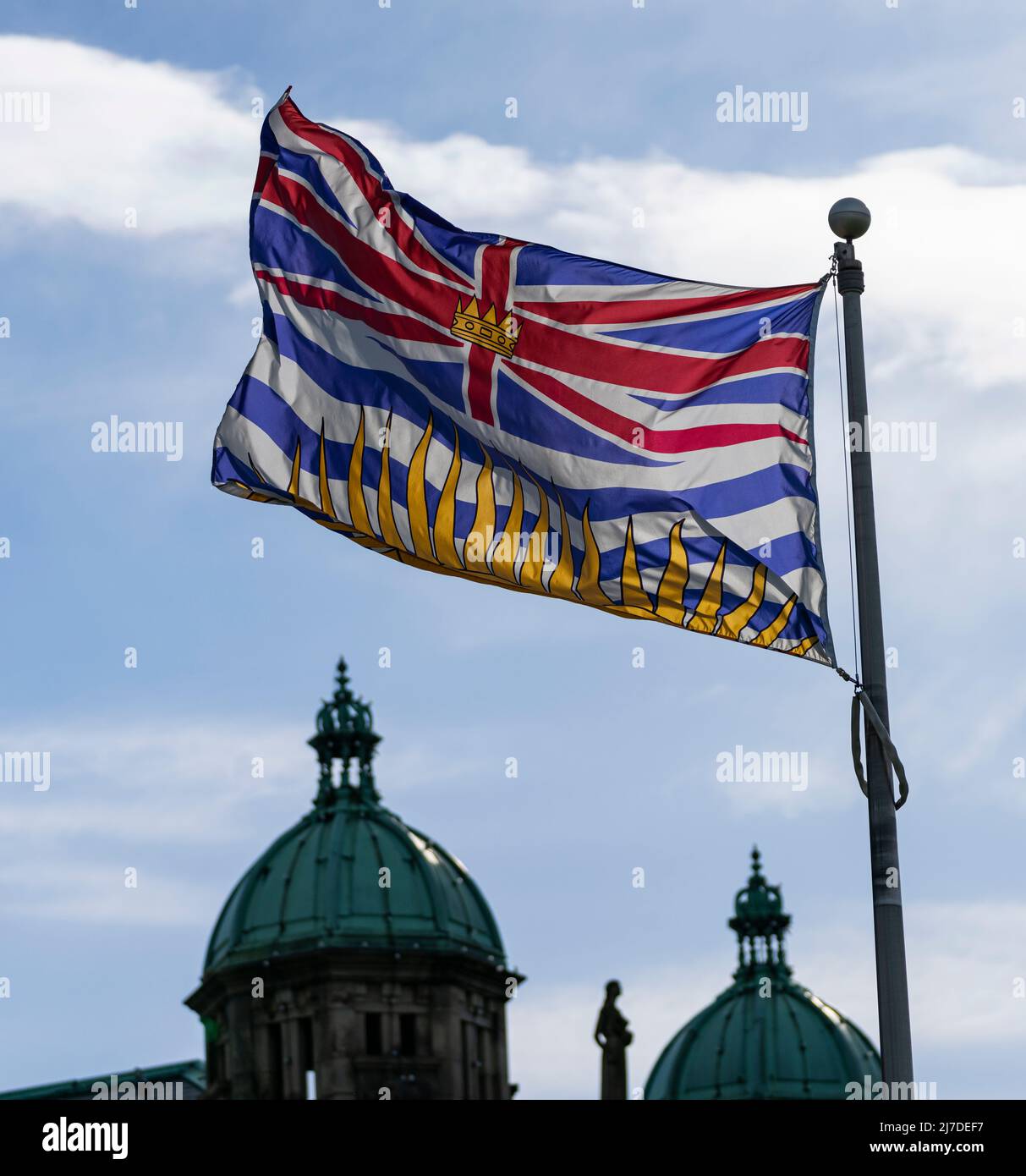 The flag of the province of British Columbia, Canada flies near the ...