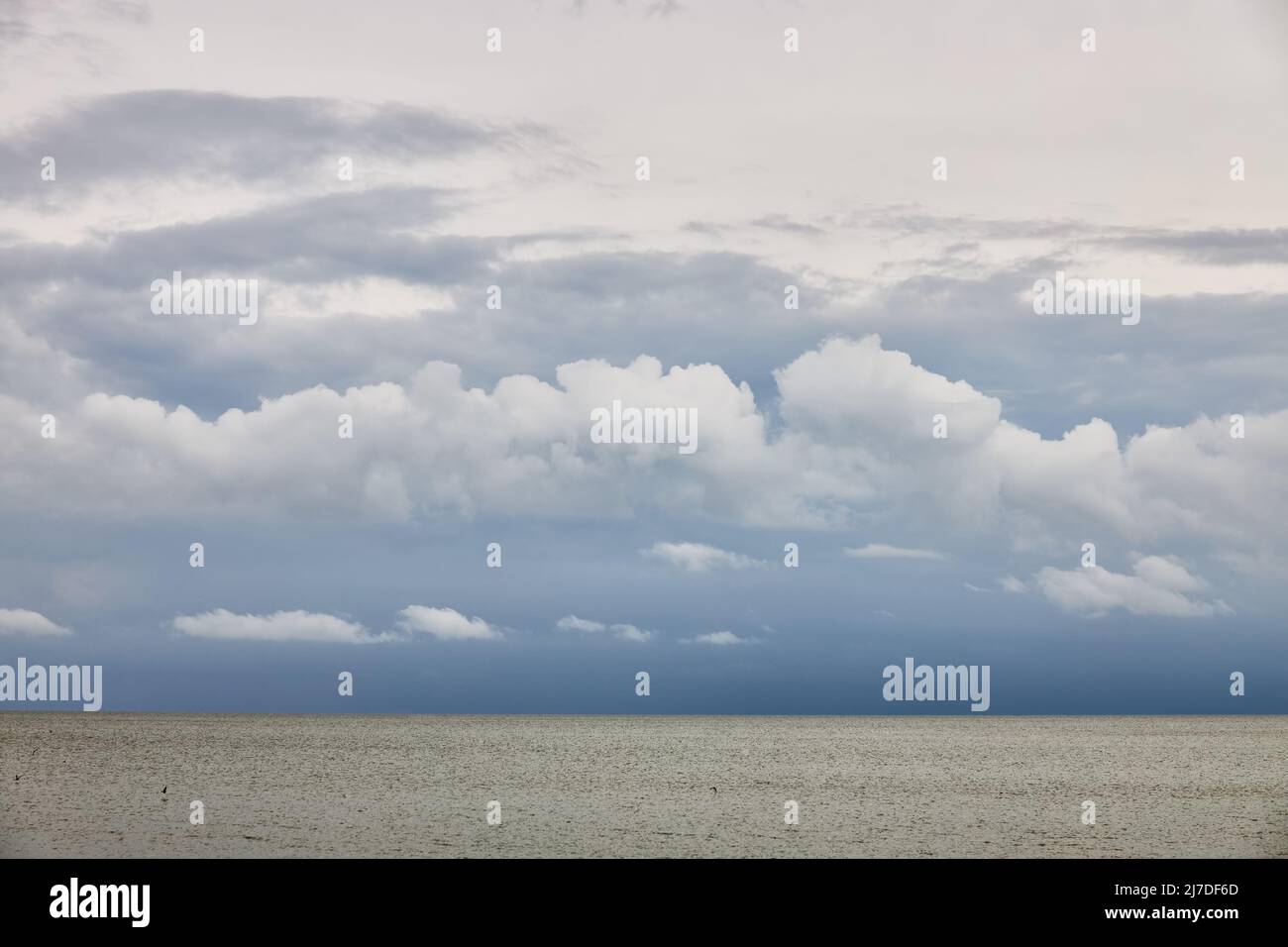 Beautiful clouds on the sea in dreary weather as a background or backdrop Stock Photo
