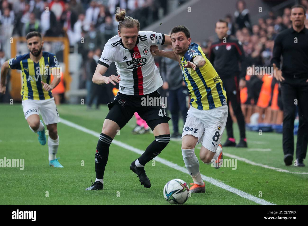 ISTANBUL, TURKEY - MAY 8: Emirhan İlkhan of Besiktas JK and Ferdi Kadıoglu  of Fenerbahce SK battle for possession during the Turkish Super Lig match  between Besiktas JK and Fenerbahce SK at