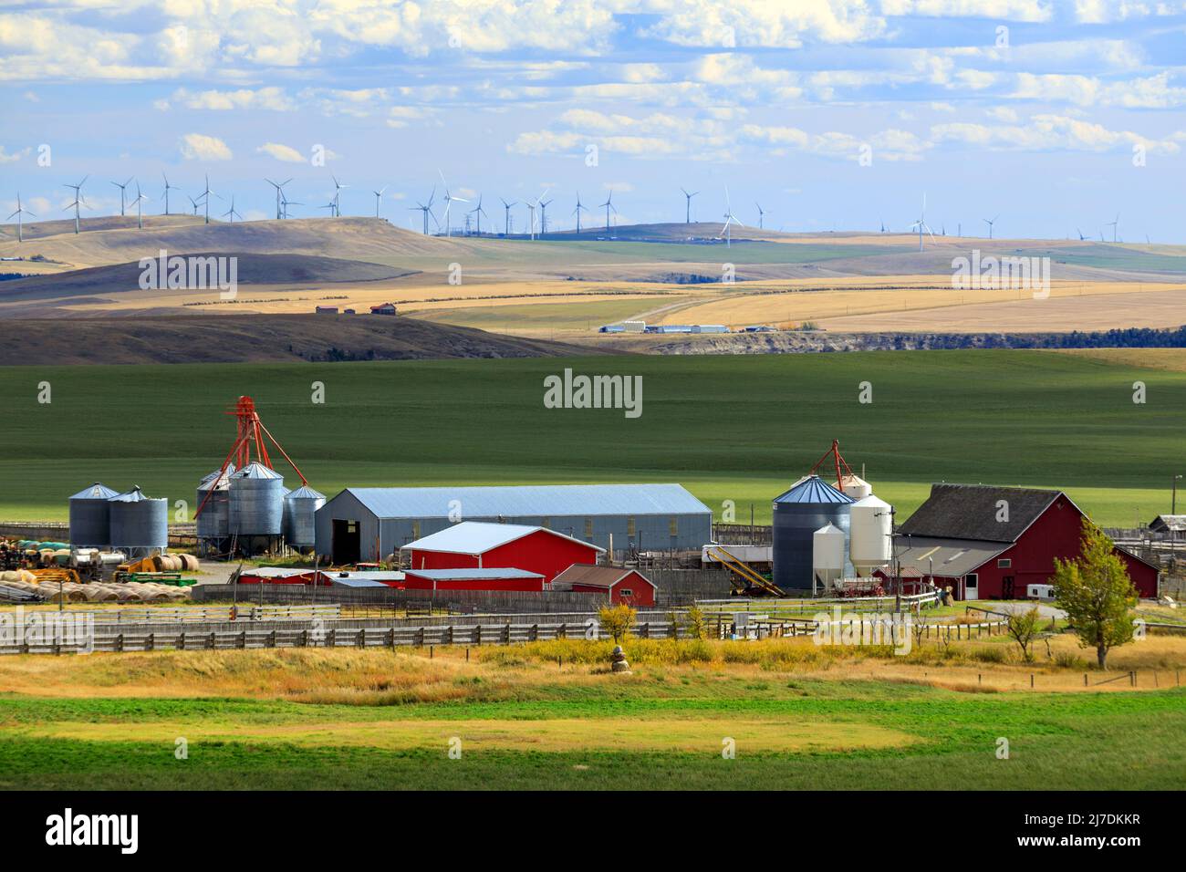 A farm and farmland agricultural landscape in the Canadian prairies near Lundbreck, Alberta, Canada. Stock Photo
