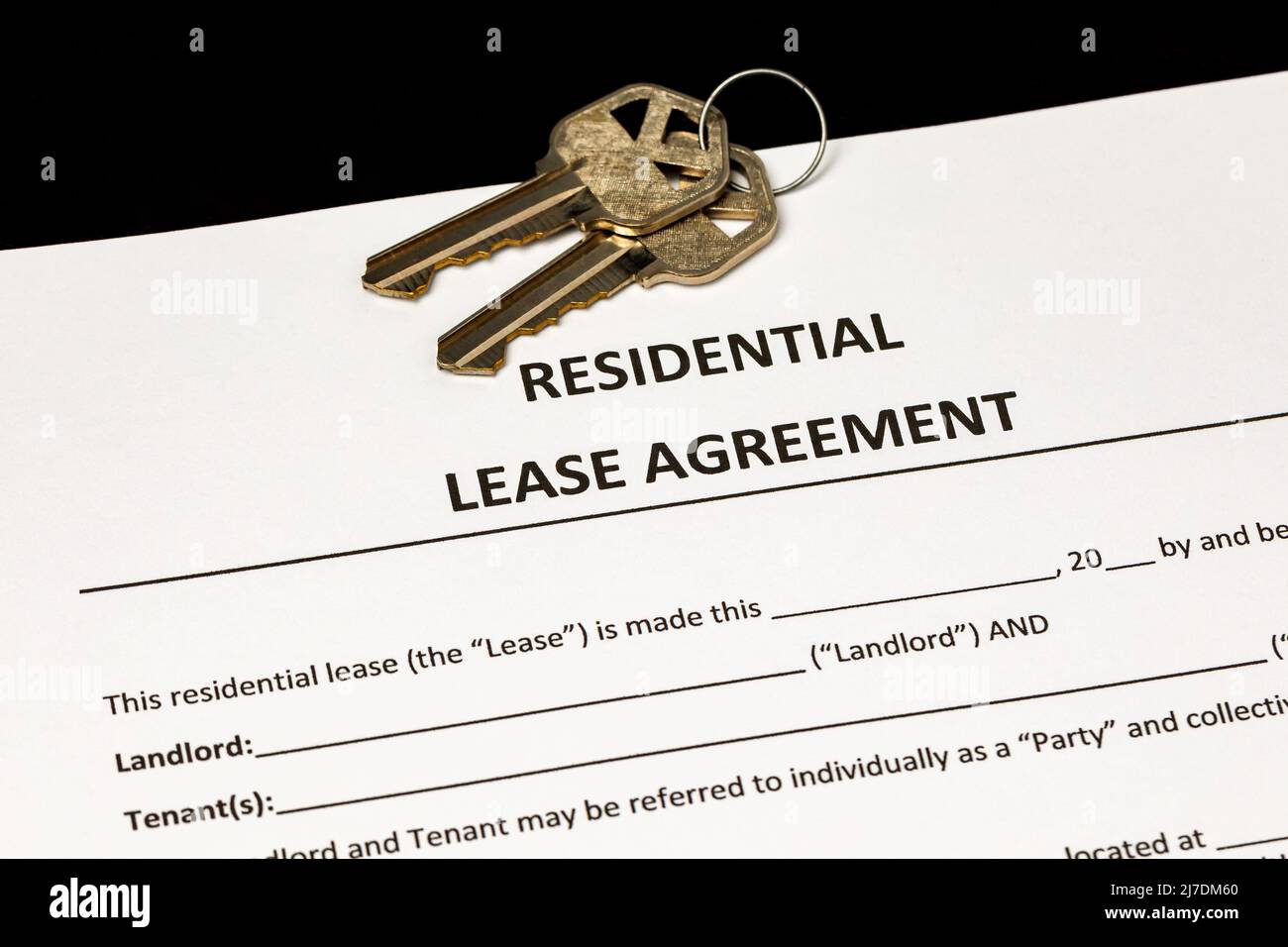 Residential lease agreement contract and keys. Home ownership, rental, and housing market concept. Stock Photo