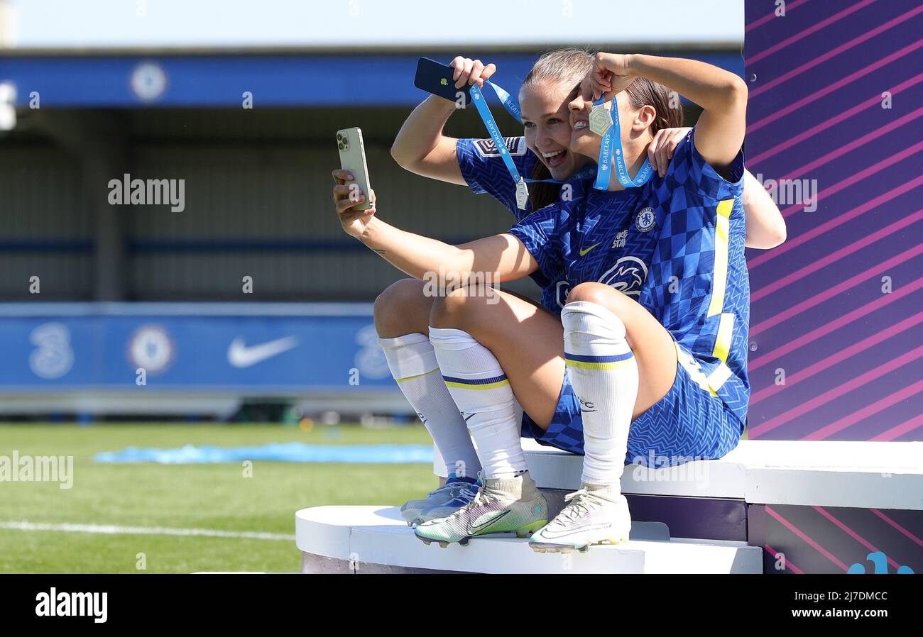 Kington Upon Thames, England, 8th May 2022. Guro Reiten and Sam Kerr of Chelsea take photos with their Womens Super League winners medals after The FA Women's Super League match at Kingsmeadow, Kington Upon Thames. Picture credit should read: Paul Terry / Sportimage Stock Photo