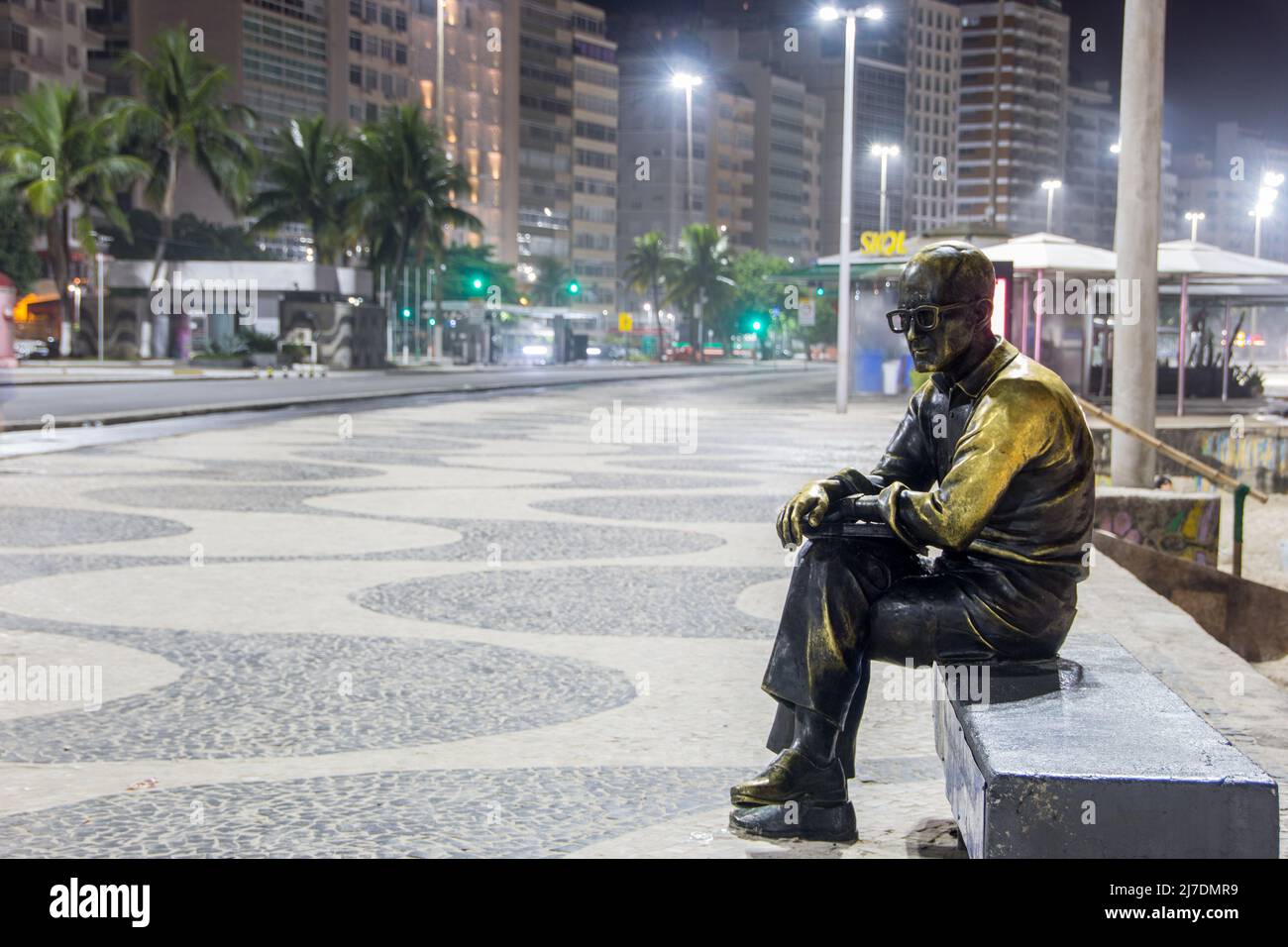 Statue of the poet by Carlos Drummond de Andrade in Copacabana in Rio de Janeiro Brazil - March 06, 2022: Statue of Carlos drummond de Andrade in Rio Stock Photo