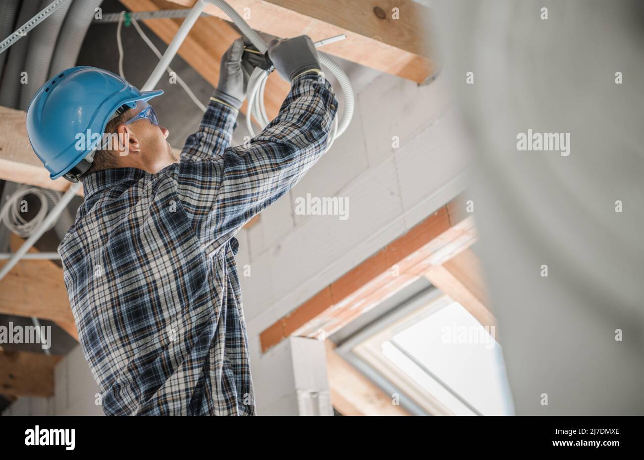 Construction Electric Contractor Worker Installing Ceiling Light Point