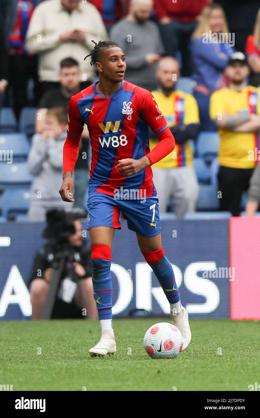 Michael Olise #7 of Crystal Palace sees his shot hit the post
