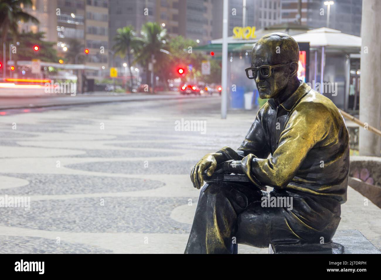 Statue of the poet by Carlos Drummond de Andrade in Copacabana in Rio de Janeiro Brazil - March 06, 2022: Statue of Carlos drummond de Andrade in Rio Stock Photo