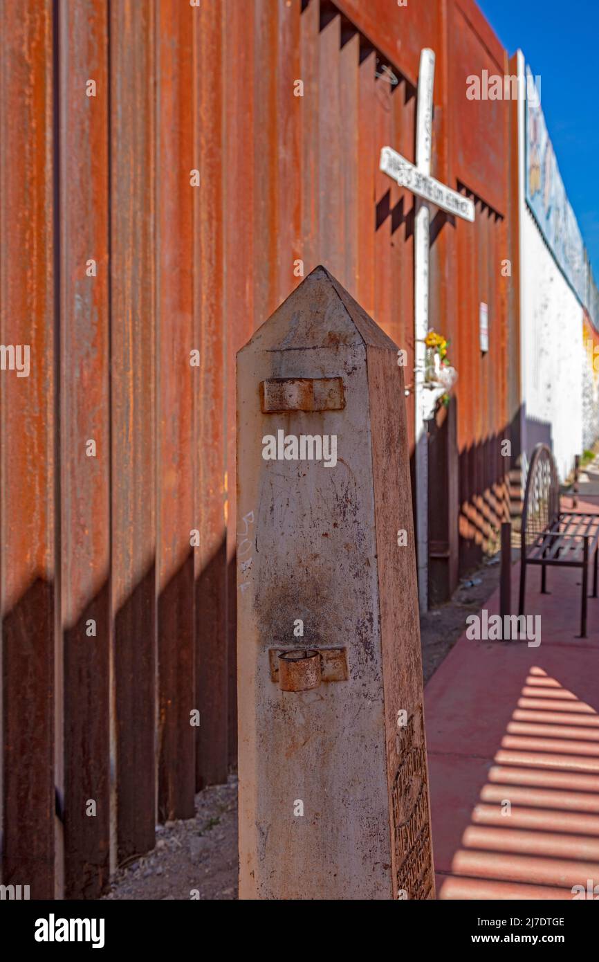 Agua Prieta, Mexico - An original century-old boundary obelisk stands on the Mexican side of the U.S.-Mexico border fence that divides Agua Prieta fro Stock Photo