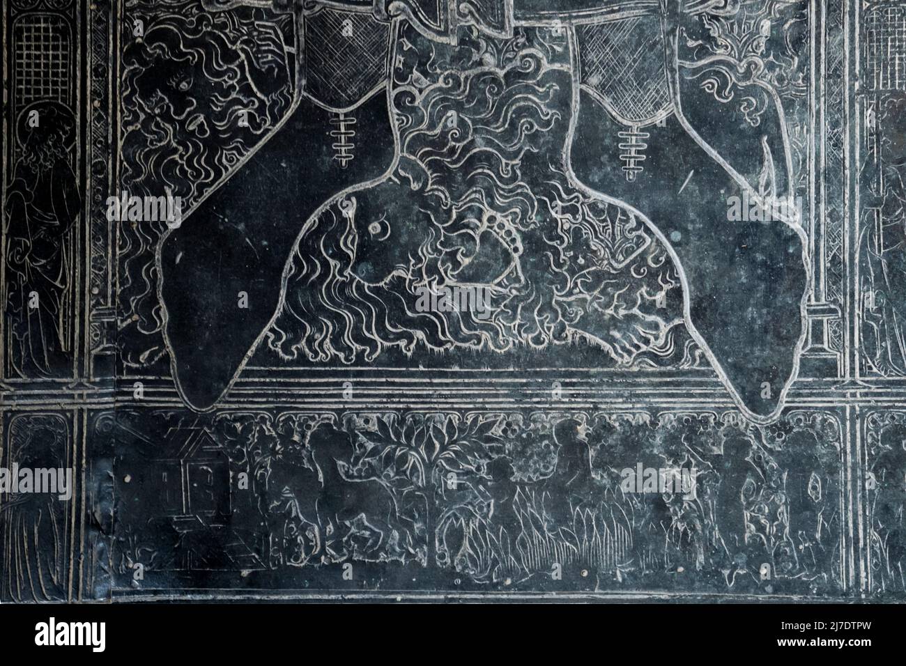 Detail of the brass to Adam de Walsoken in St Margaret's church, King's Lynn.  At base is the earliest known representation of a windmill in England. Stock Photo