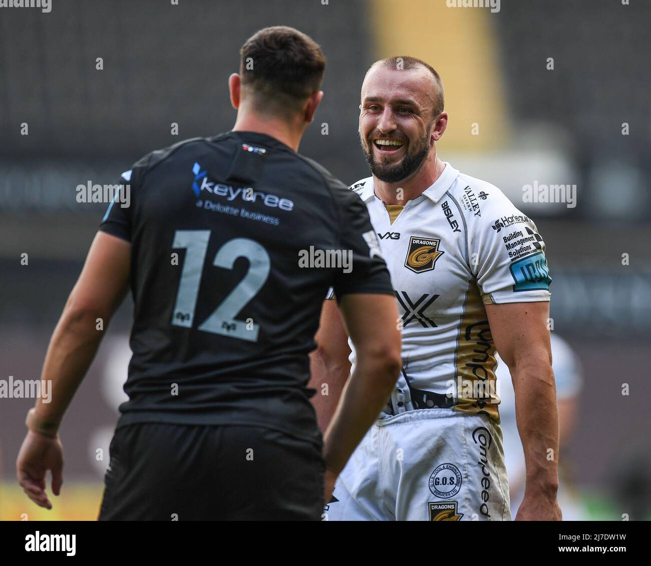 Ollie Griffiths of Dragons, and Owen Watkin of Ospreys, share a joke