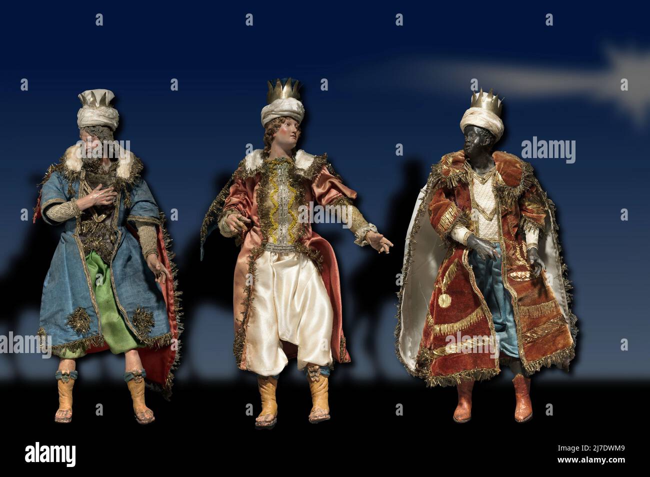 Statuettes depicting the Three Kings in painted wood and terracotta with various fabrics, produced in Naples (Italy) in 1800. Stock Photo