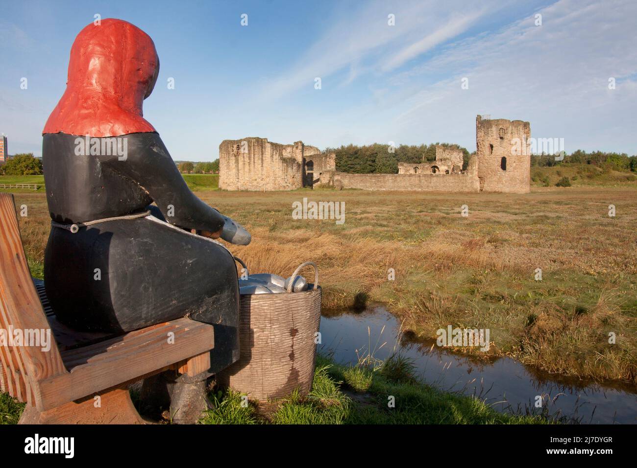 Flint Castle & sculpture of medieval fishermans wife woman by Mike Owen, Flintshire, North Wales Stock Photo