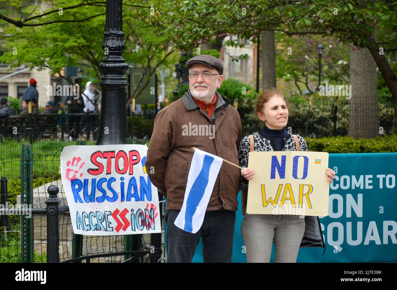 Aged couple holding No War sign at Union Square during the Ukraine Rally in New York City/ Stock Photo