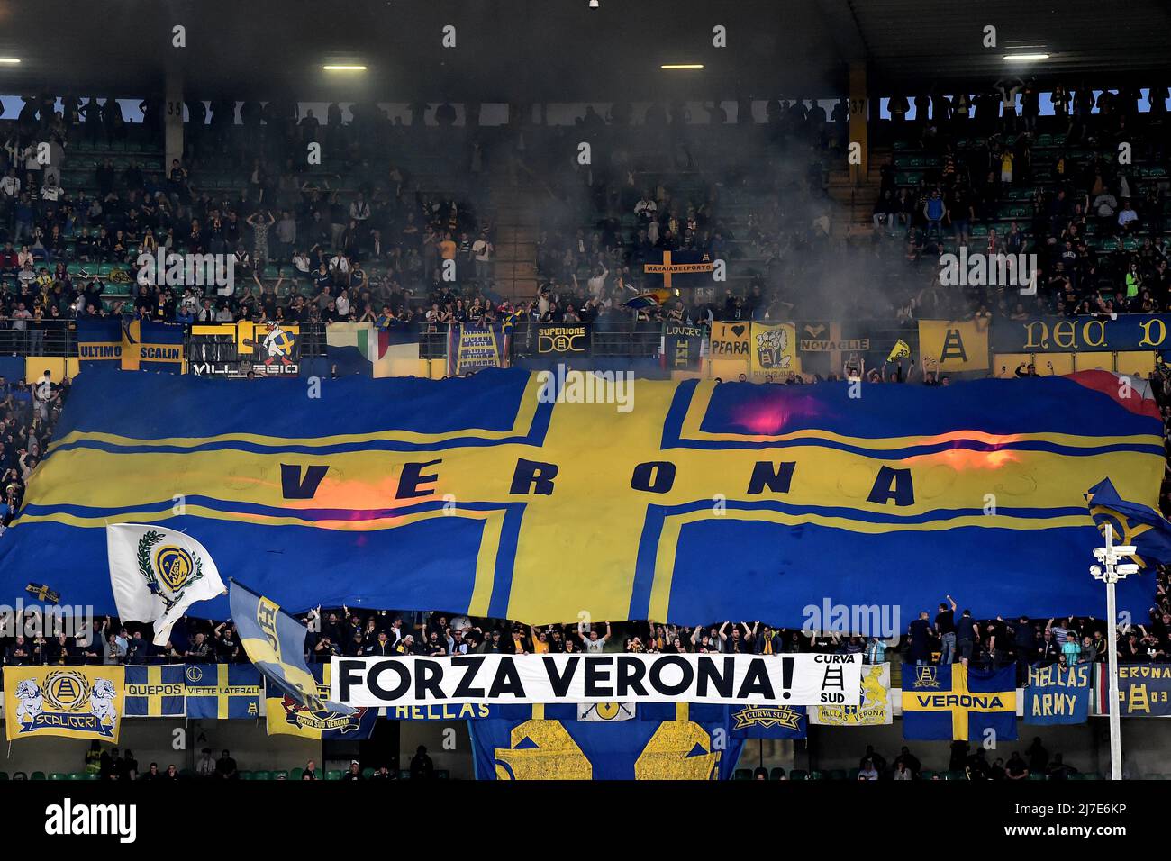 Verona (Italy), May 8th, 2022. Hellas Verona supporters cheer on showing a  giant flag during the Serie A 2021/2022 football match between Hellas Verona  and AC Milan at Marcantonio Bentegodi stadium in