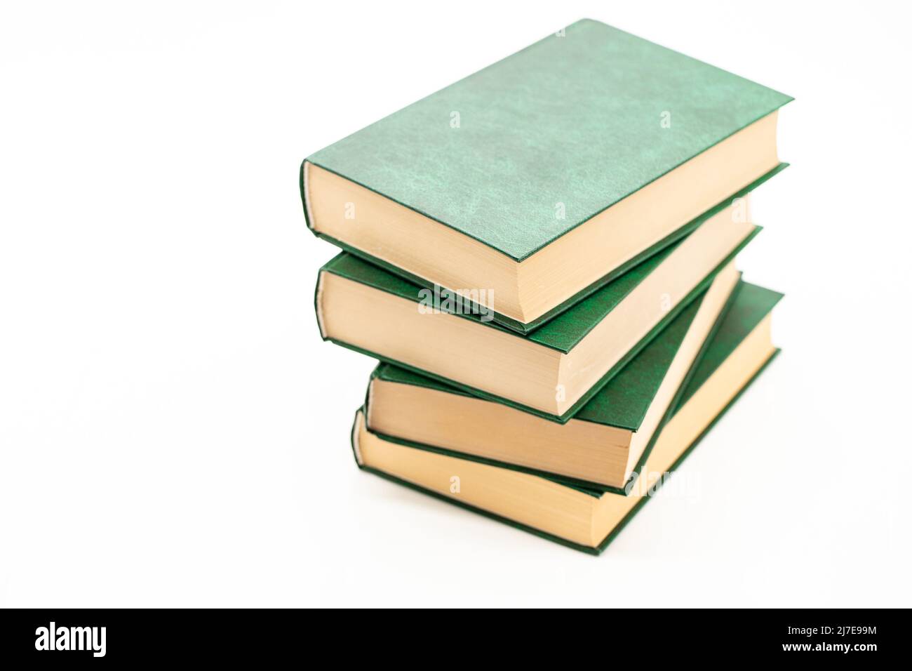 Books stack with green covers on a white background.Reading of books..Reading and education. Literature and reading  Stock Photo