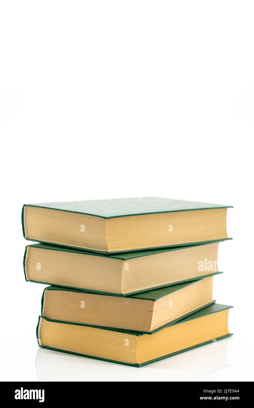 Literature and reading concept. Books stack with green covers on a white background.Reading of books. Knowledge concept.Reading and education Stock Photo
