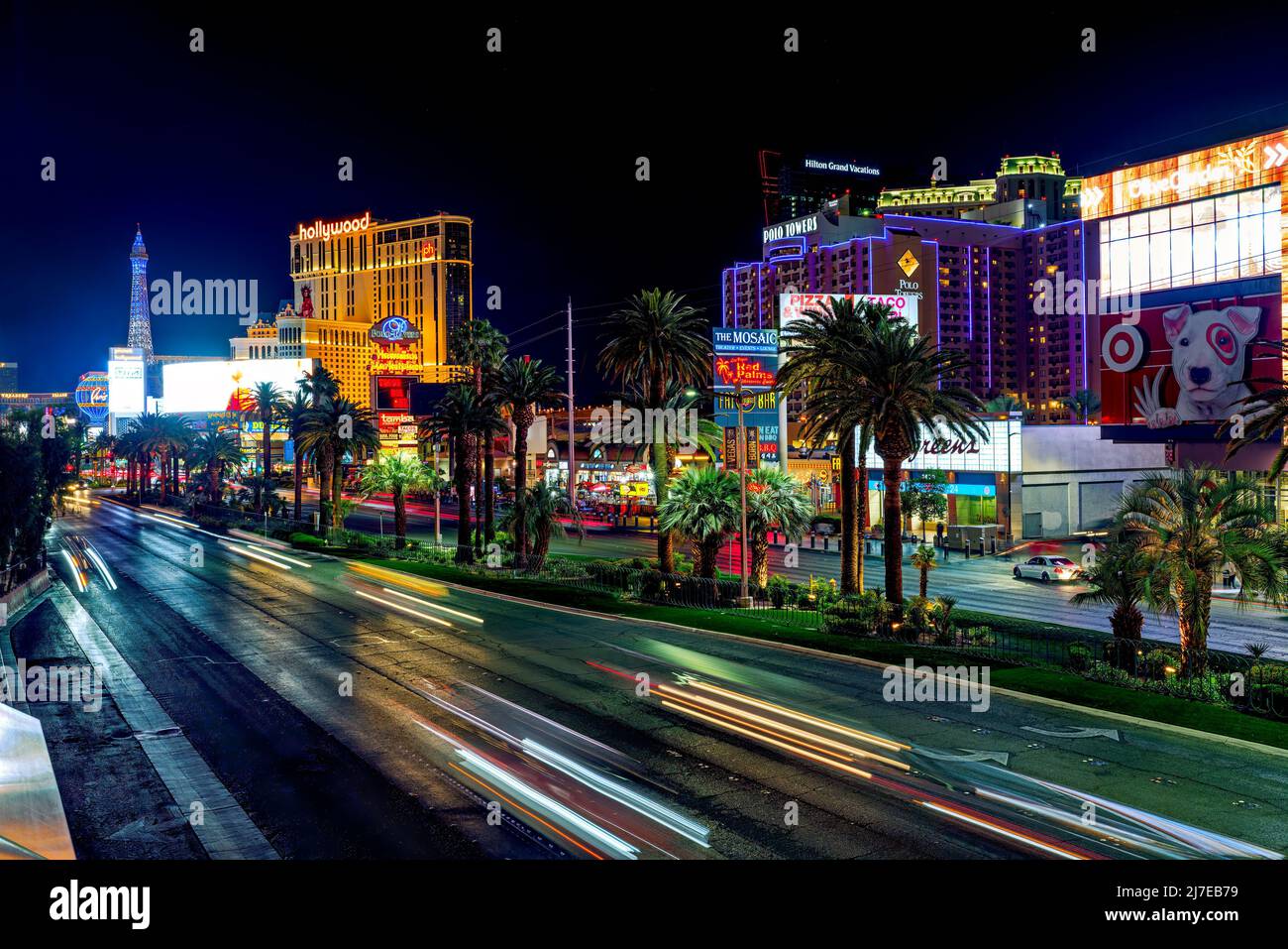 Las Vegas, Nevada, USA - May 4, 2022.  Las Vegas Strip at night. Street view, hotels, traffic, city life. Paris, and Planet Hollywood Hotel and Casino Stock Photo