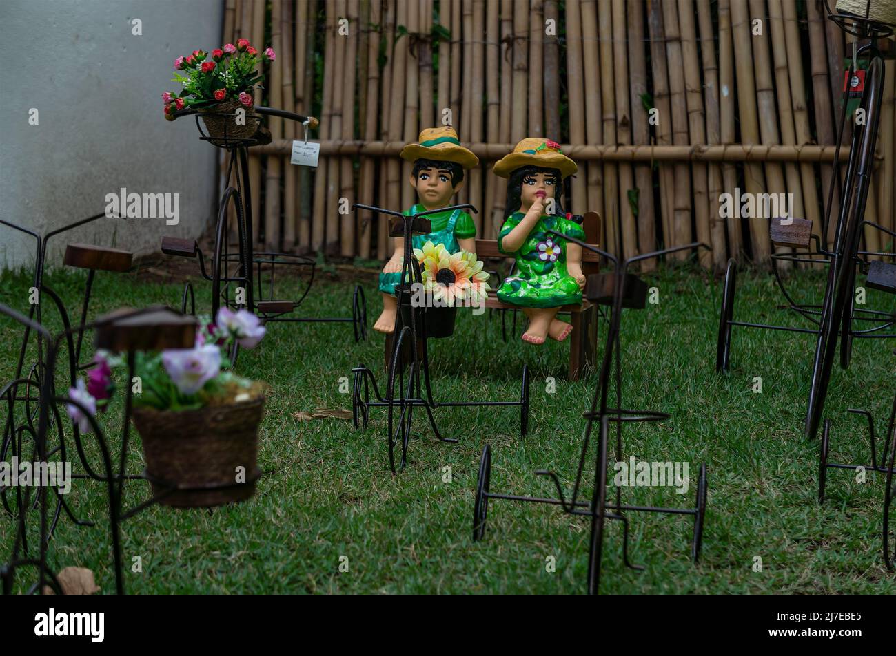 Many garden ornaments for sale on an outdoor grass field of Rosa de Saron store. Local business specialized in metal handmade crafts. Stock Photo