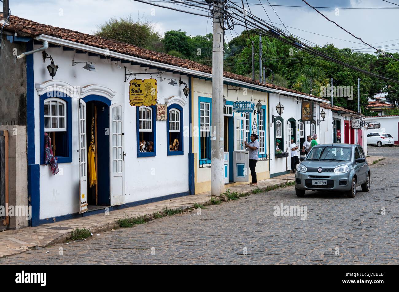 Many colorful colonial buildings with small local business running in it at Inconfidentes street, nearby Tiradentes historical center. Stock Photo