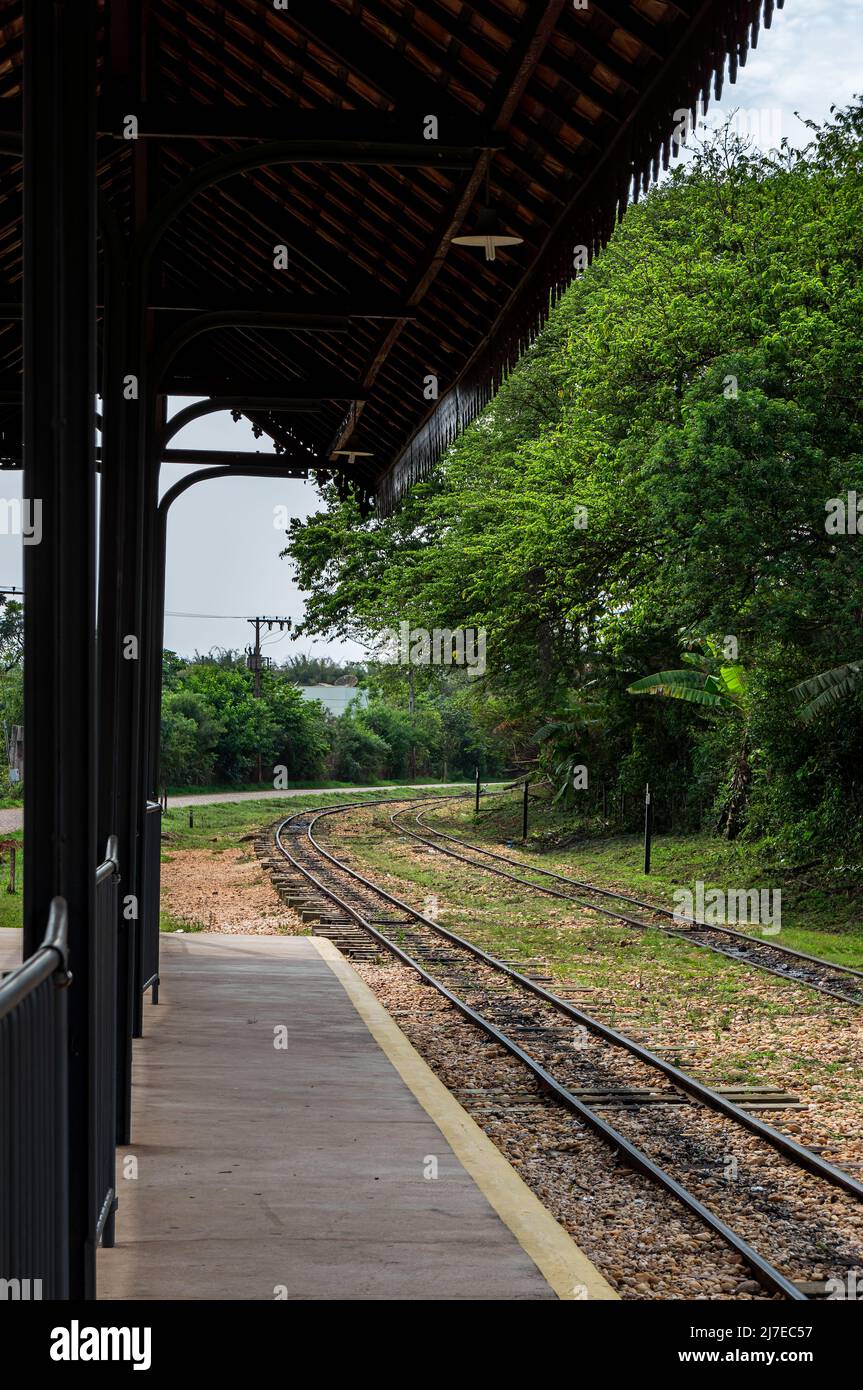 The empty colonial Tiradentes train station platform with train tracks right at it. Station located nearby Praca da Estacao square in Tiradentes. Stock Photo