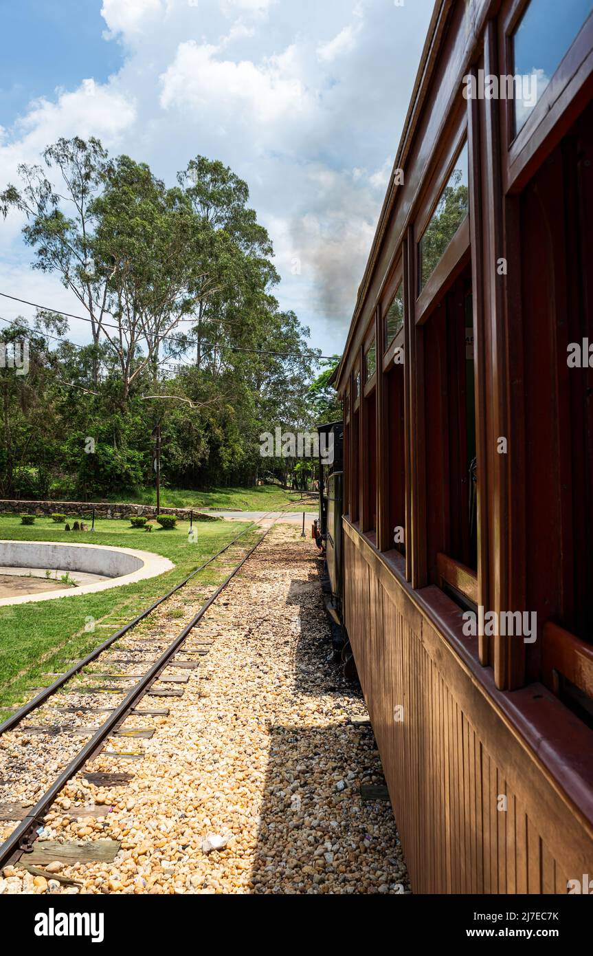 View from one of the passenger of the touristic steam locomotive train stopped at Tiradentes station while awaiting passengers before depart. Stock Photo