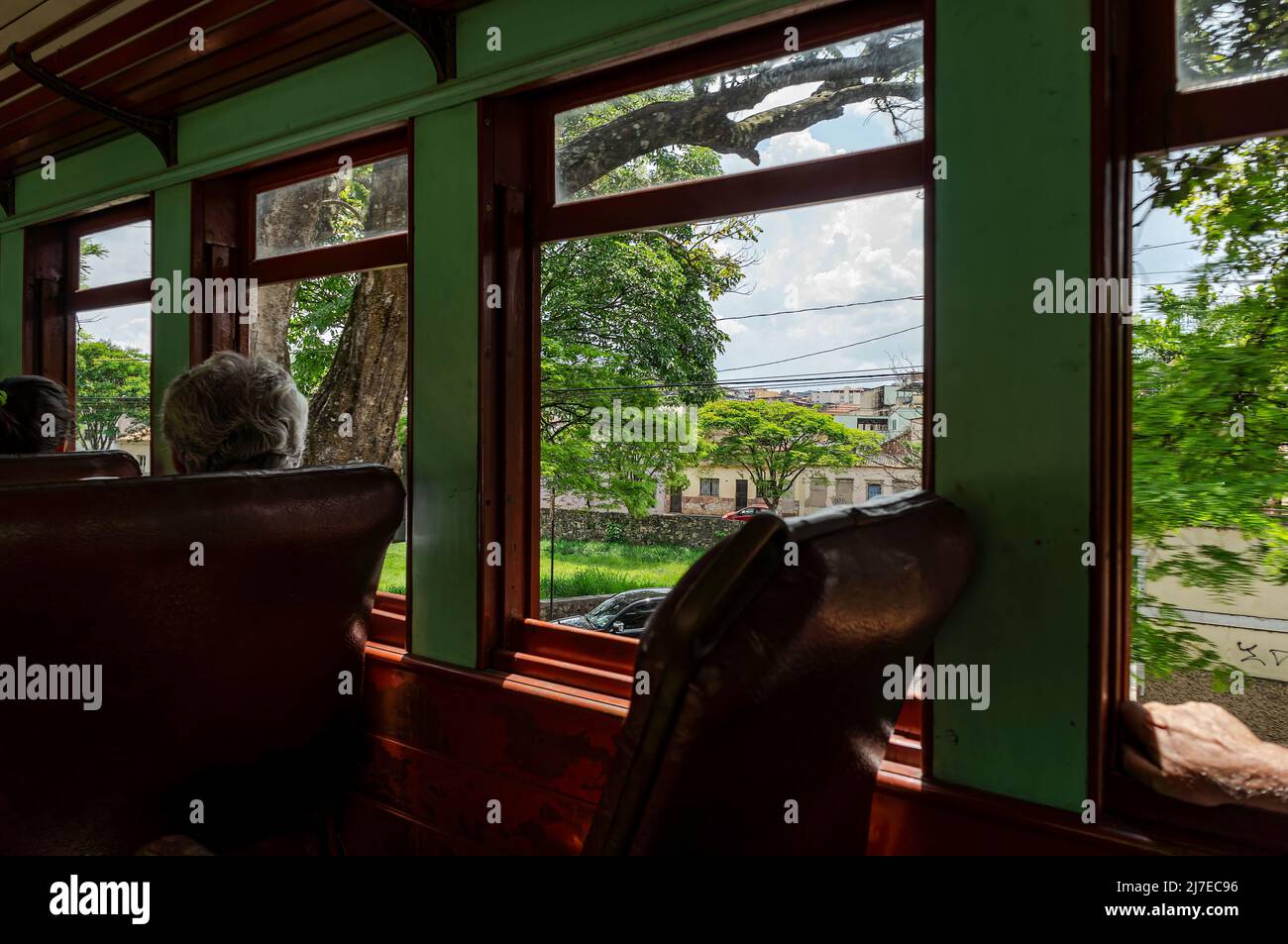 Cityscape passing by passenger car window of the touristic steam train ride while arriving at Sao Joao del Rei coming from Tiradentes village. Stock Photo