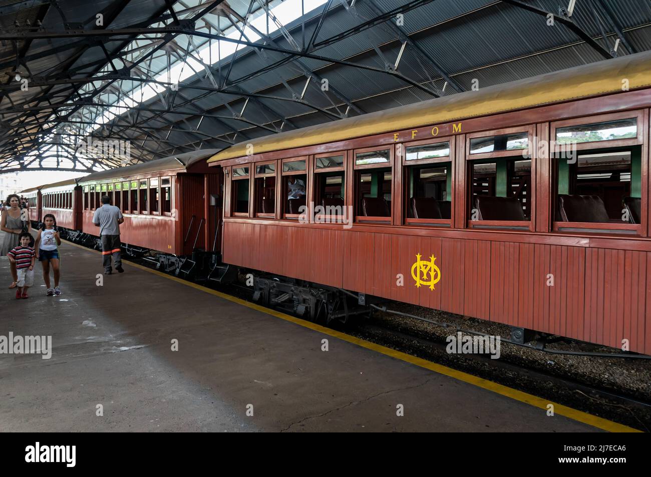 Vintage brown passenger cars stopped at Sao Joao del Rei train station right after arrive from Tiradentes village. Stock Photo